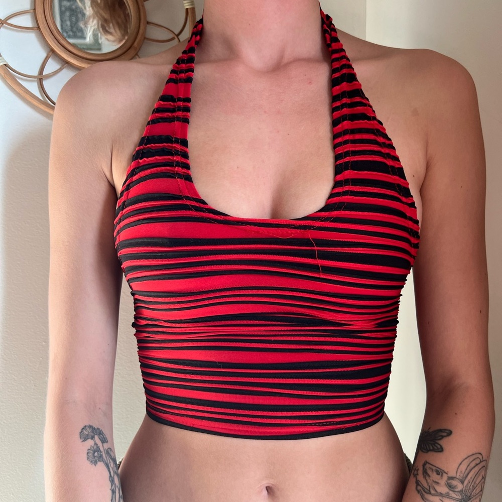 Red and black crop top, open back. Large, fits like small.